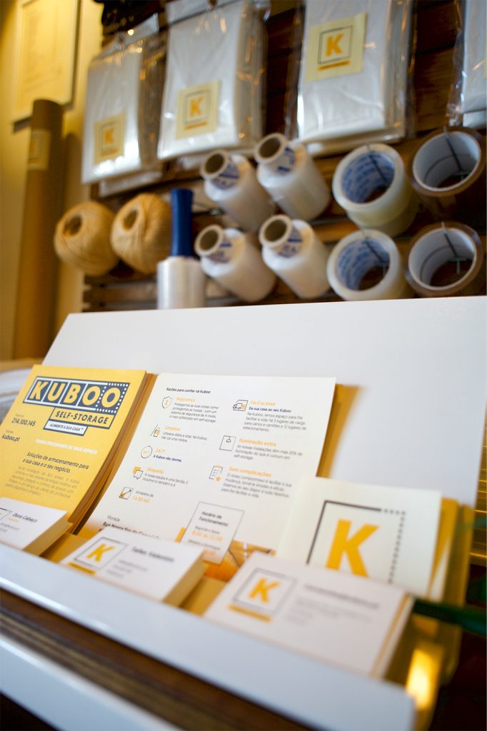 a stand with kuboo flyers, stickers and business cards