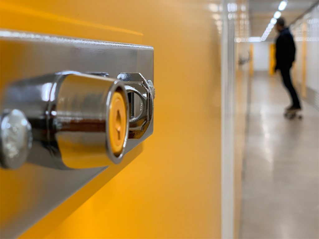 a kuboo lockers with person skating in the background