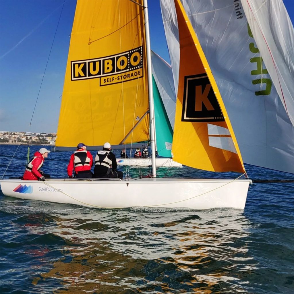 sail boat with yellow sail with kuboo logo